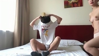 A Pair Of Chinese Lovers Sharing A Hotel Room