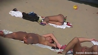 Uninhibited Couples Bask In The Sun And Explore Their Desires On A Candid Nude Beach