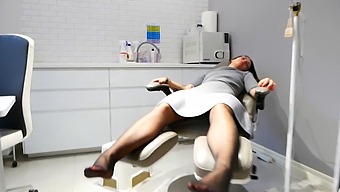 A Sexy Masseuse Satisfies Her Client'S Foot Fetish In A Gym Setting
